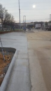 Commercial Concrete Parking Lane with Curbed Island