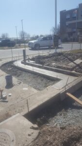 Curved Concrete Curb Pour Around Utility Conduit