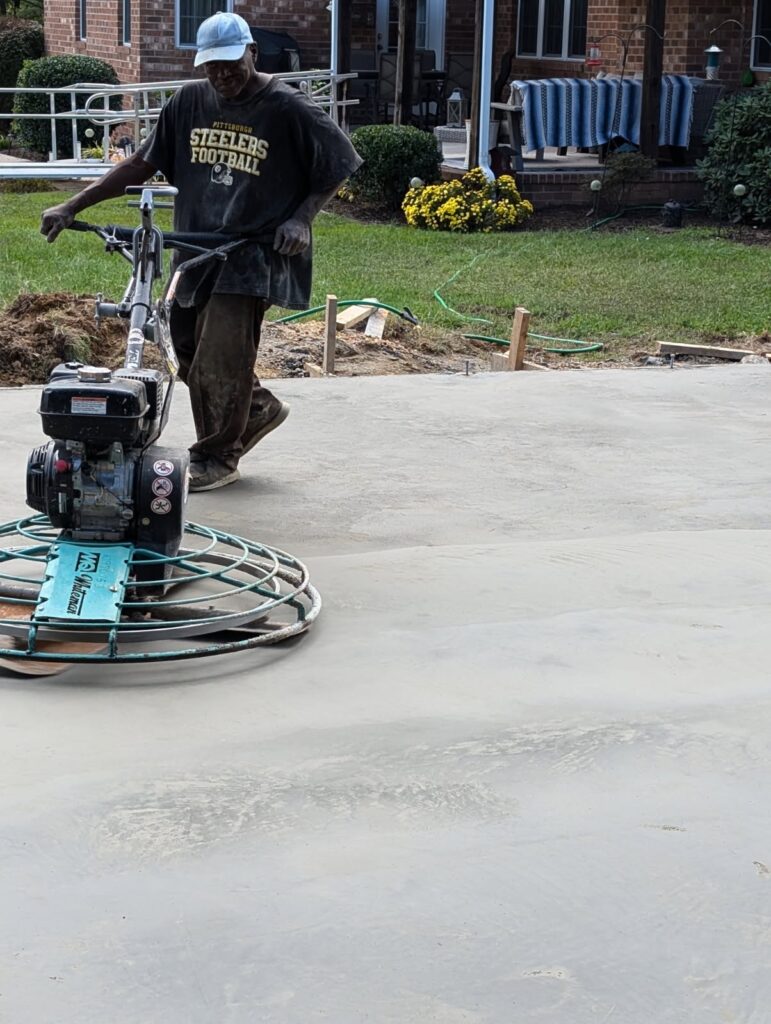 Power-troweling a new slab for a smooth, durable finish.