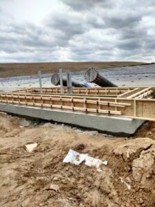 Forms and footing in place for a structural concrete pad.
