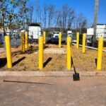 Safety bollards installed to protect the equipment pad.